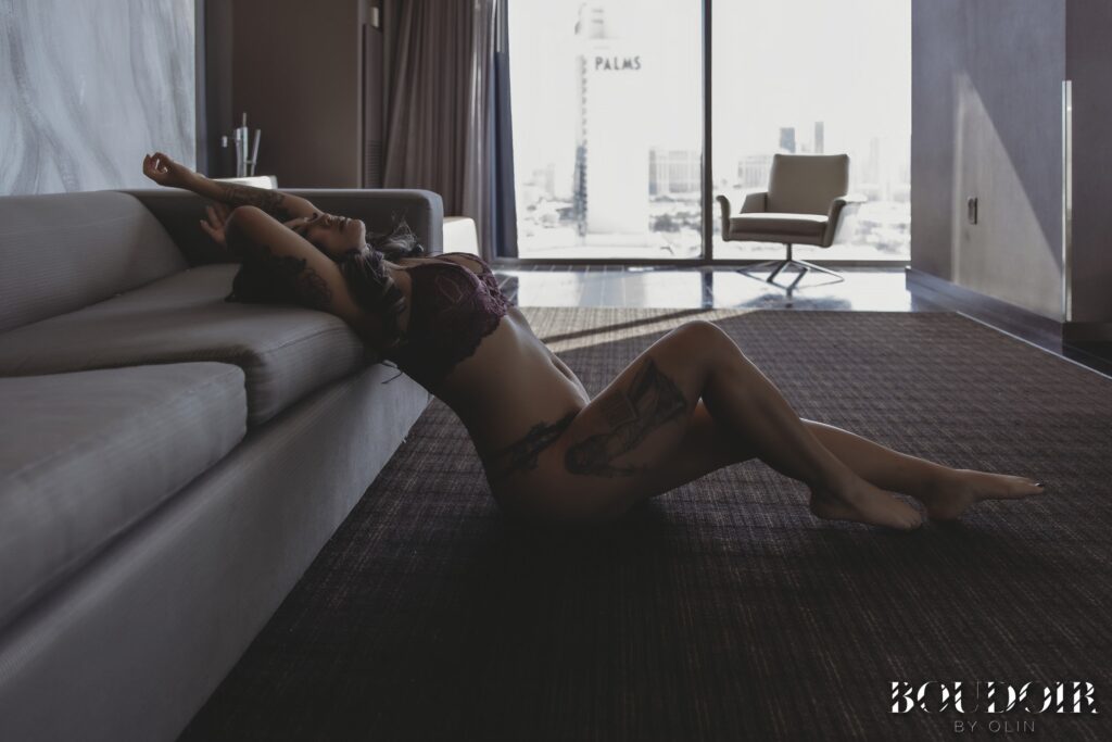 woman reclining on couch in boudoir photo