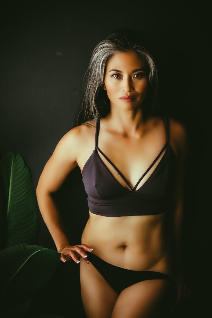 Woman on wall in Sacramento Boudoir Studio