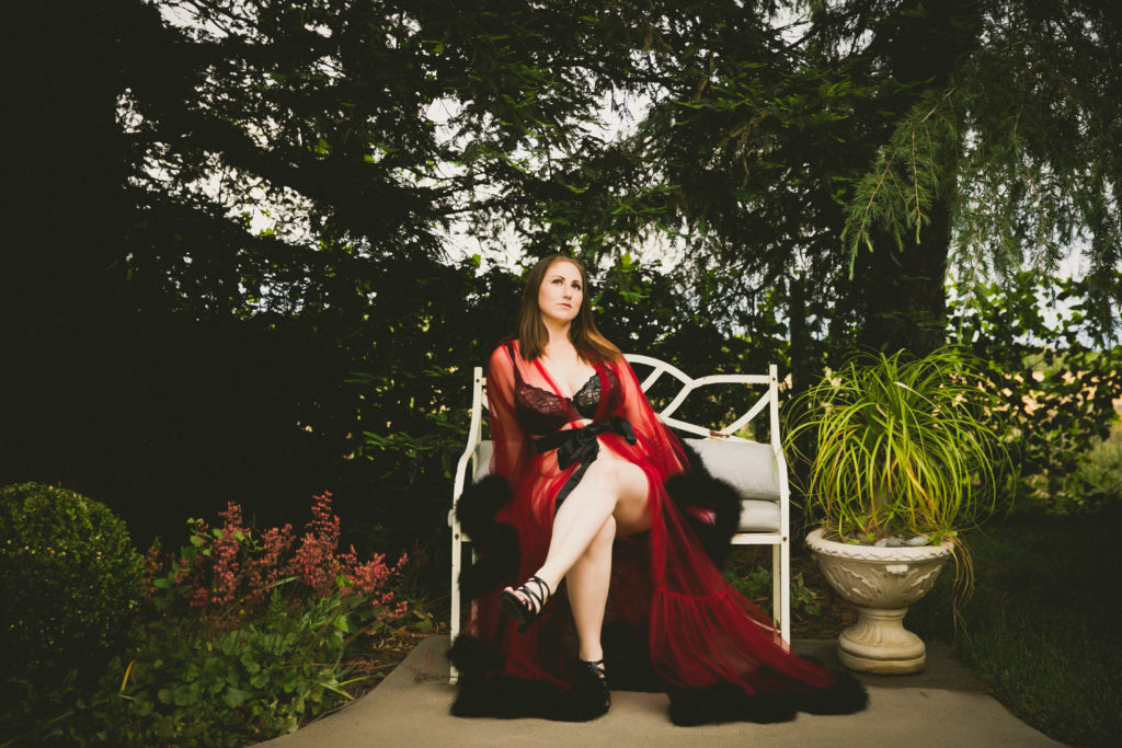 Woman in gown posing outdoors for boudoir photoshoot in California